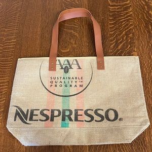 Brand new Nespresso cotton lined jute bag with Pu leather straps.